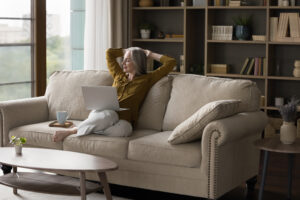 Woman relaxing at home while browsing online, representing flexible ordering without autoship on Freedom ship pass