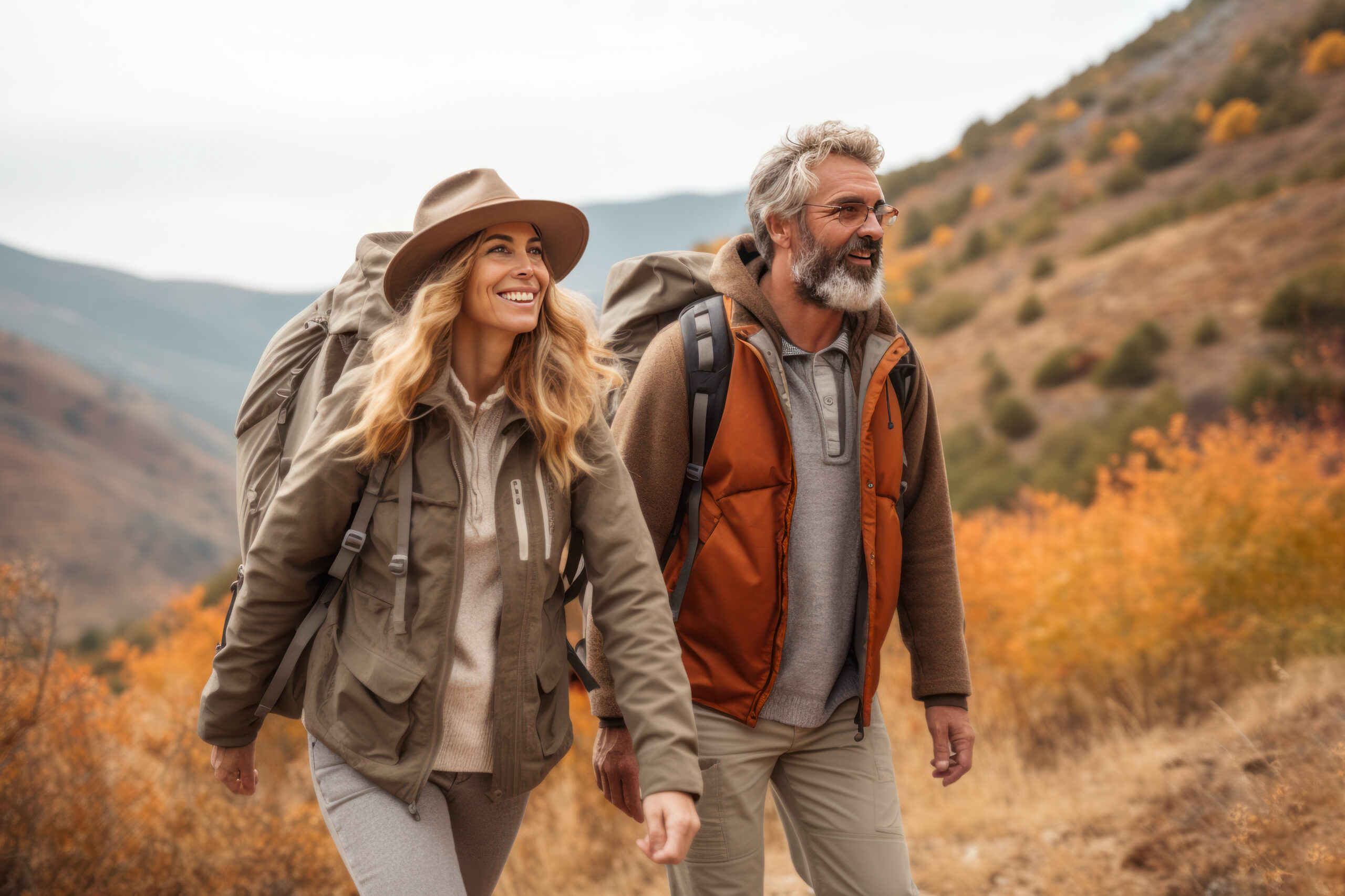 Active couple over 60 hiking outdoors, representing healthy aging and the importance of calcium absorption as stomach acid changes with age.