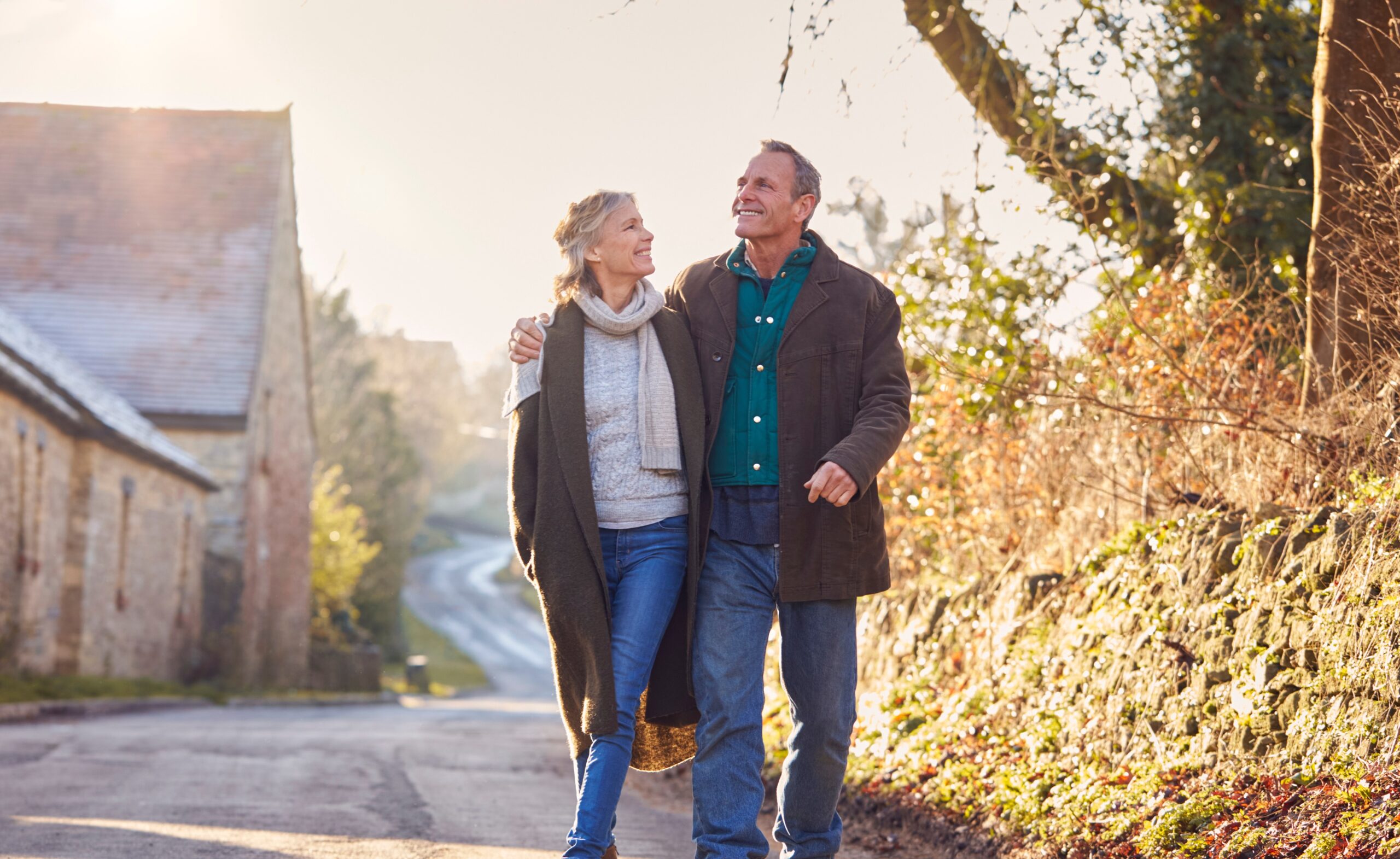 Couple walking outdoors as part of a daily routine that supports occasional constipation relief